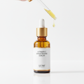 Vitamin C brightening serum in amber glass dropper bottle